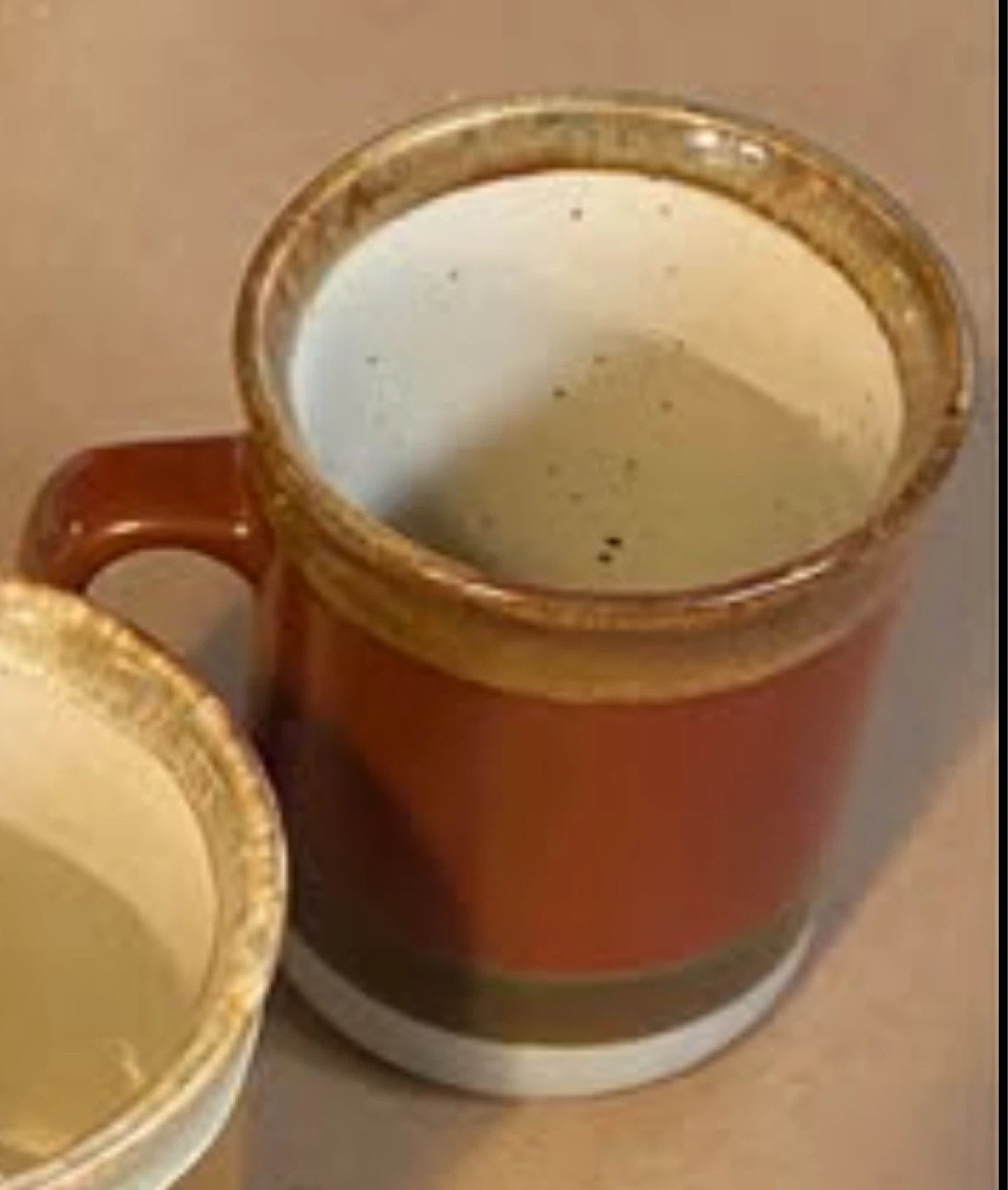 Terracotta and white speckled mug