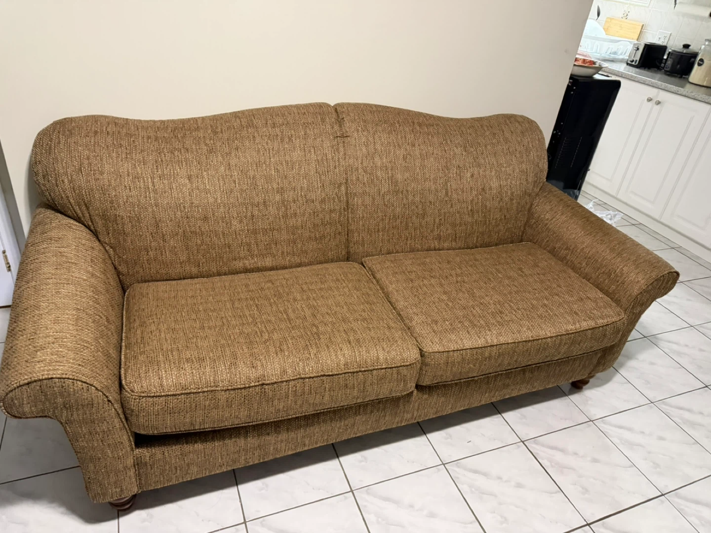 Brown two-seater sofa