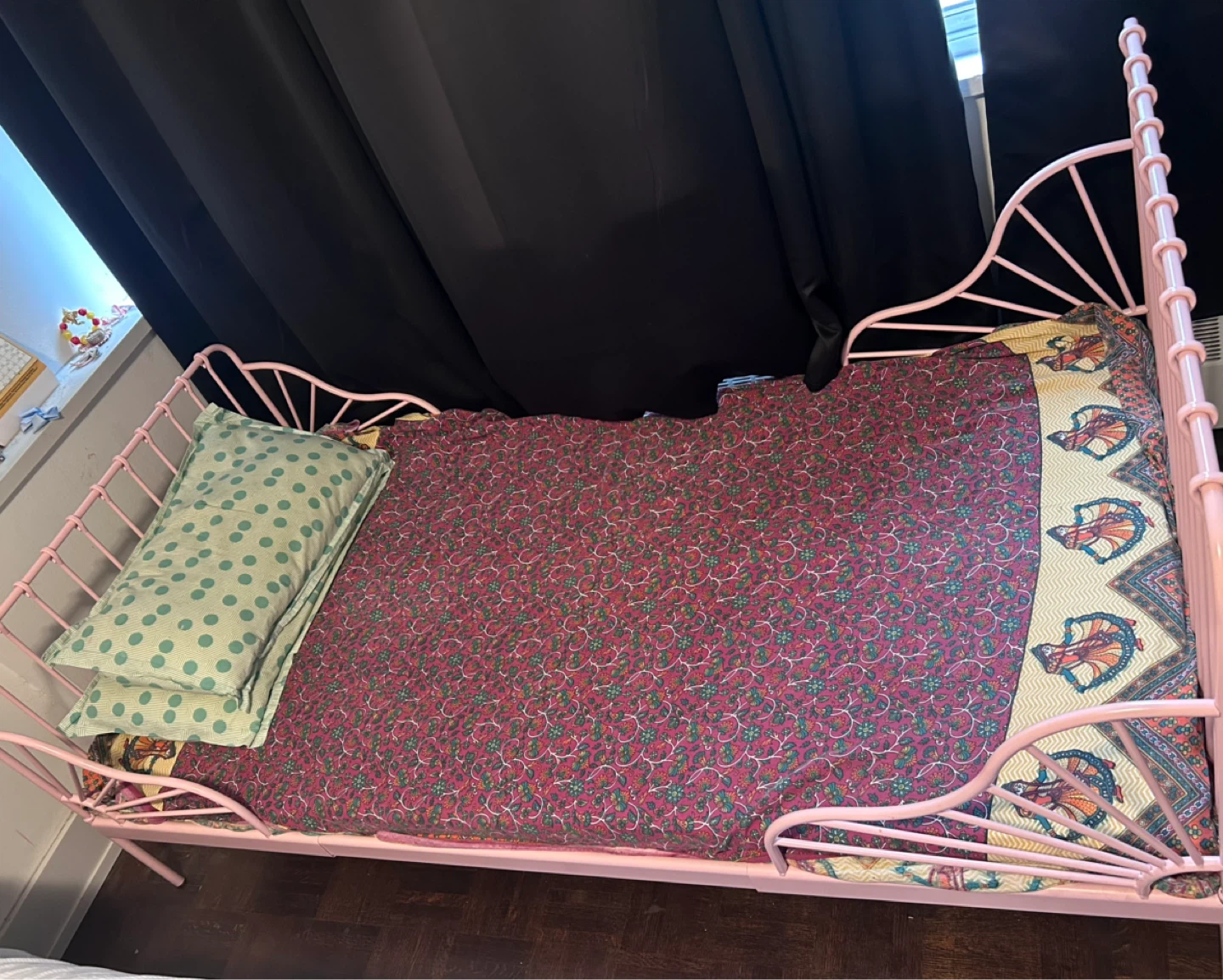 Pink Metal Twin Bed Frame with Pillows and Bedding