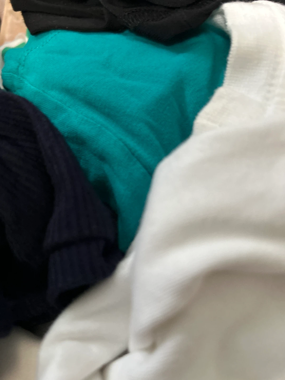 Bundle of t-shirts: black, teal, navy, and white