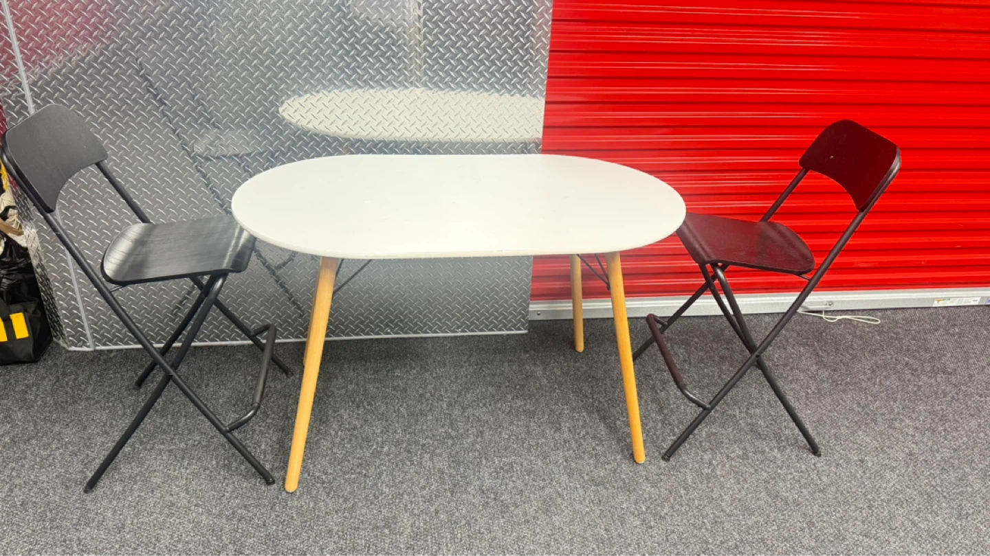 White Oval Dining Table with 2 Black Folding Chairs - photo 2