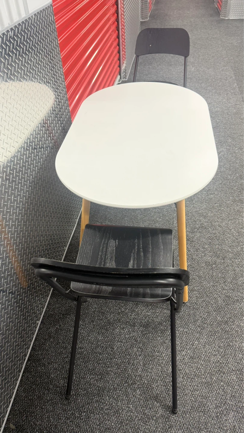White Oval Dining Table with 2 Black Folding Chairs - photo 5