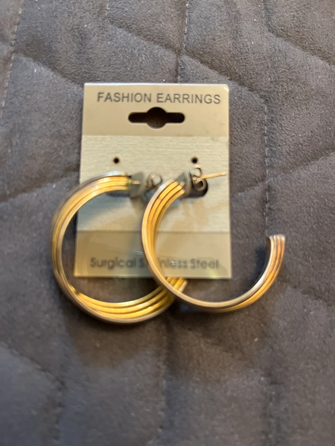 - Gold Tone Hoop Earrings