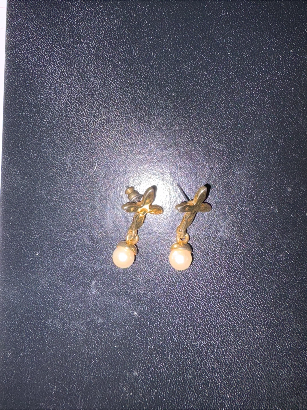 Gold tone dangle earrings with pearl beads