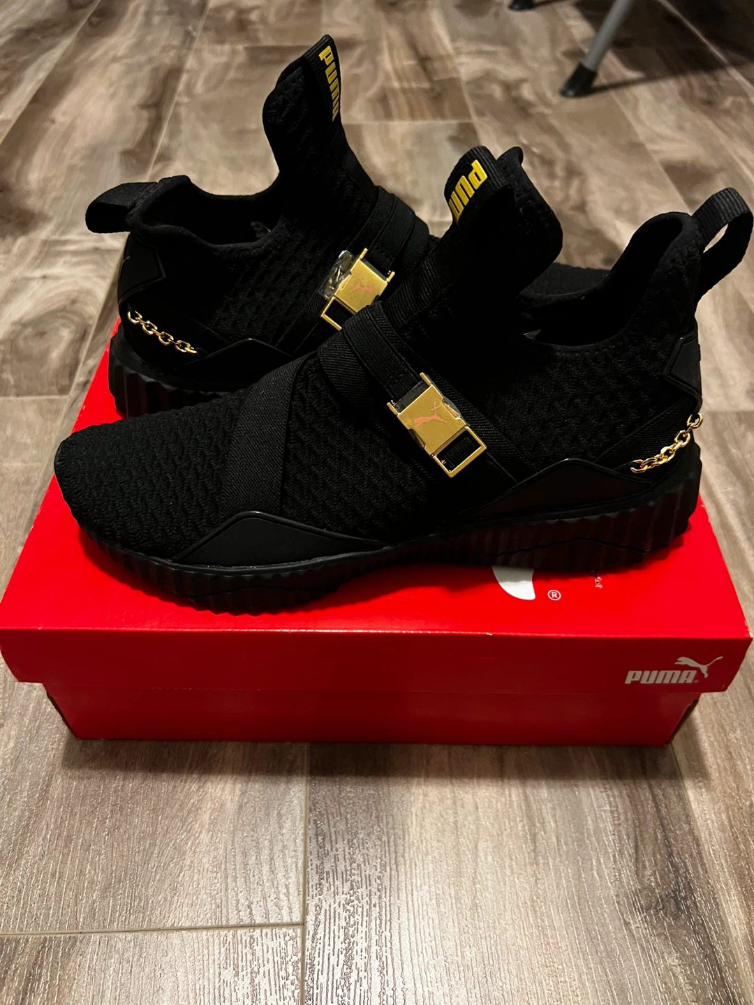 Puma Women's Black Sneakers with Gold Accents