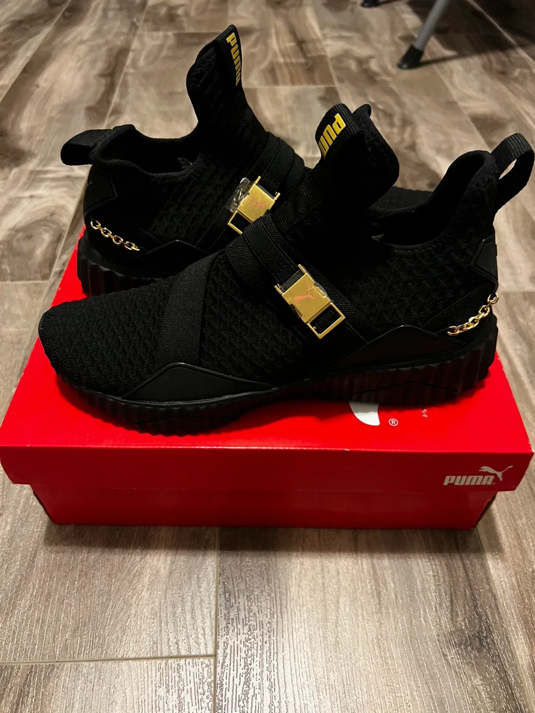 Puma Women's Black Sneakers with Gold Accents