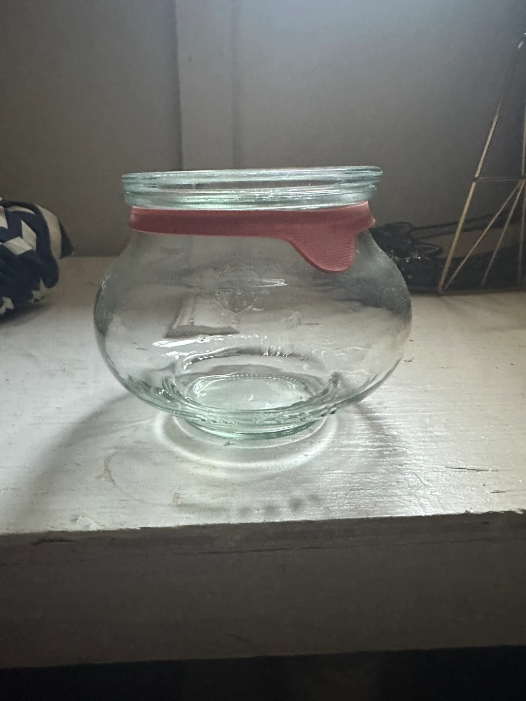 Glass jar with red lid