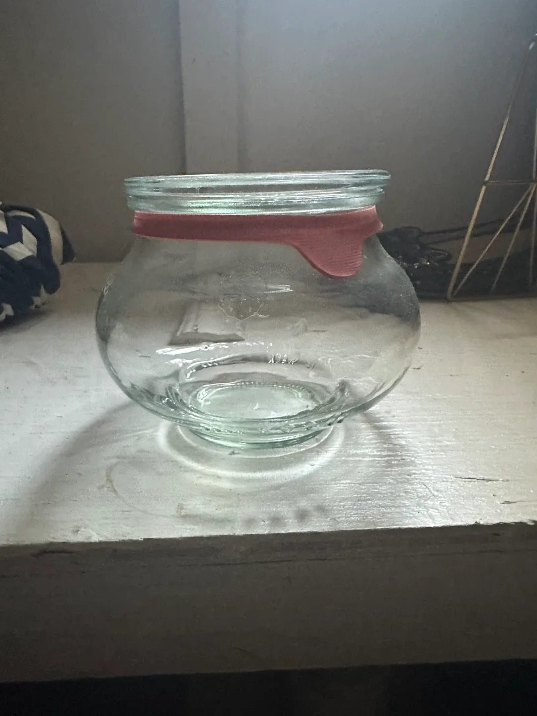 Glass jar with red lid