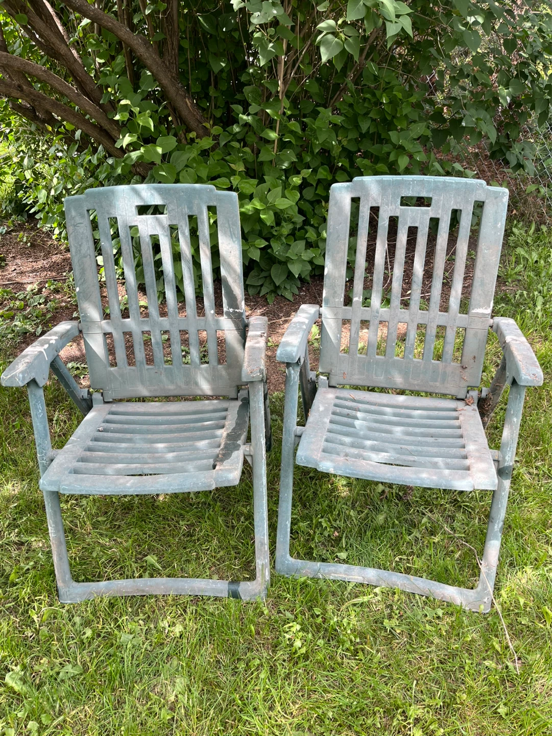 Pair of Green Plastic Folding Lawn Chairs