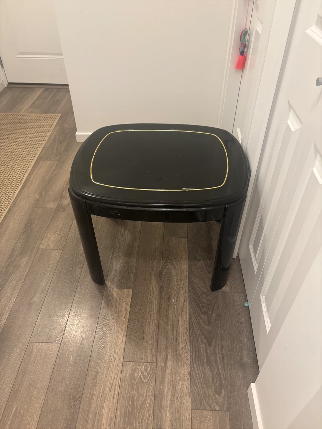Black accent table with gold trim