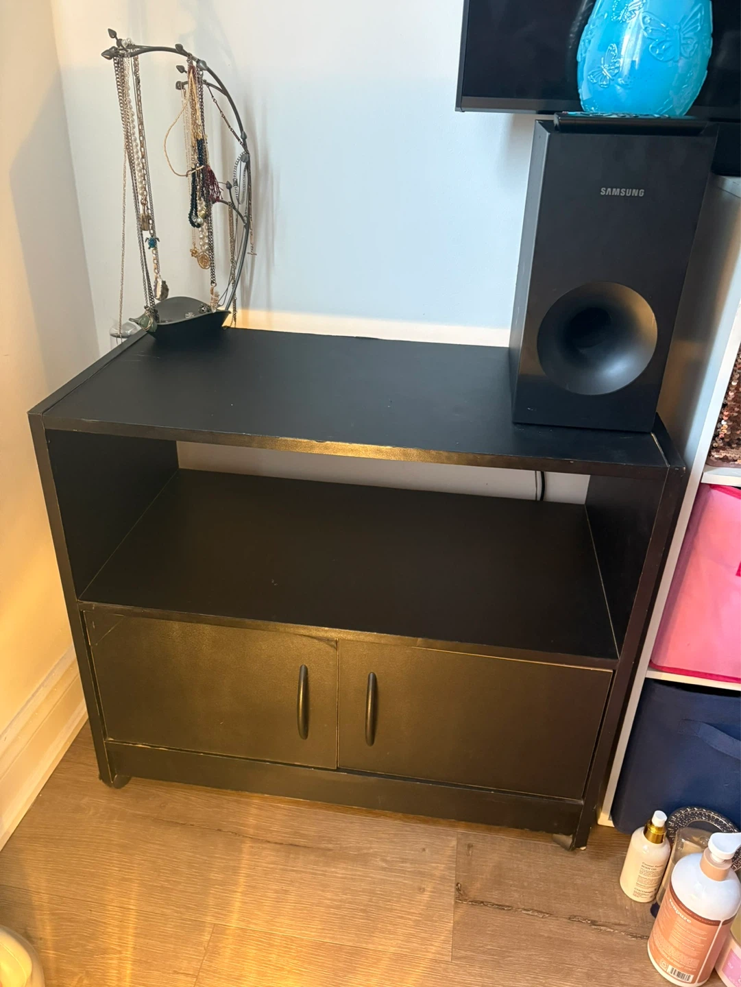 Black media console with shelves and cabinet