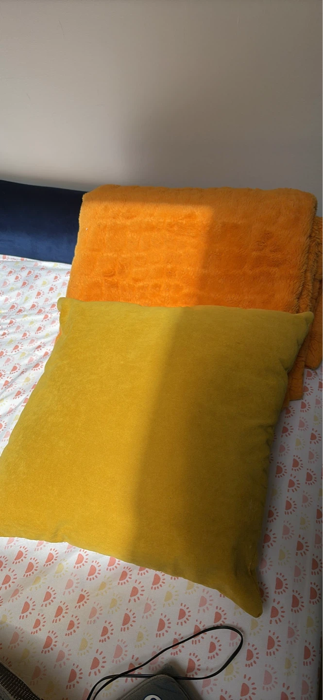 Mustard Ottoman with pillow and throw