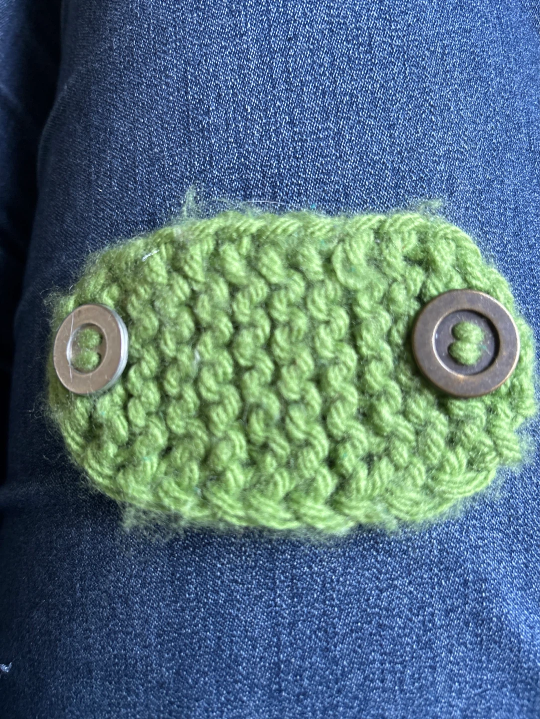 Hand-knitted green mask extender with buttons