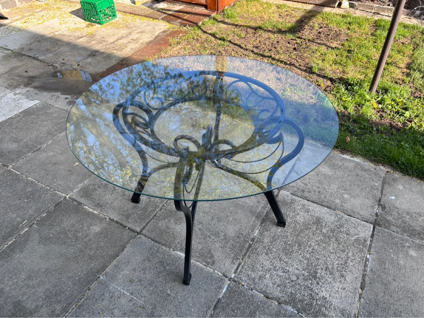 Round Glass Top Table with Ornate Black Metal Base