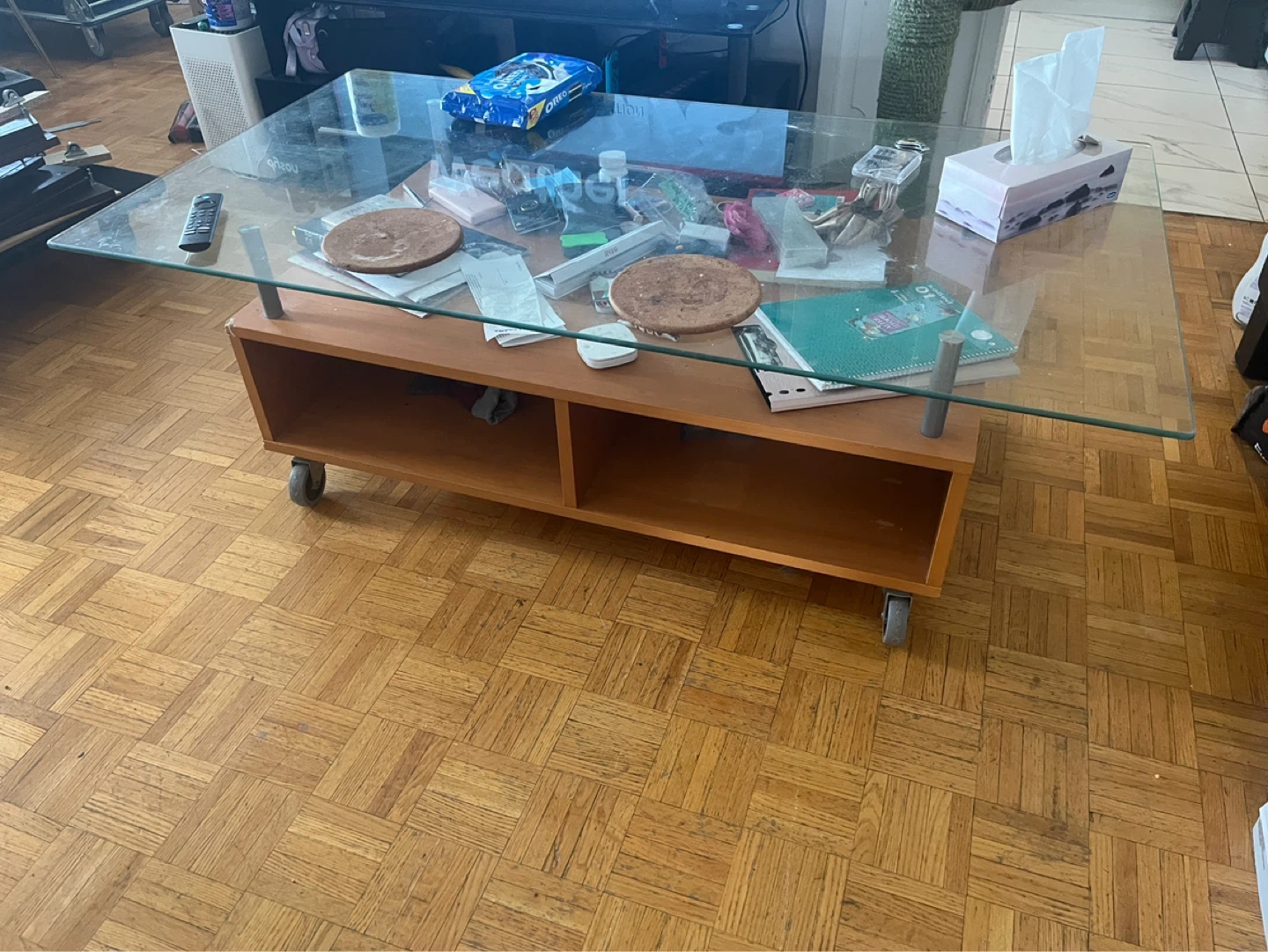Glass Top Coffee Table with Wooden Base and Wheels