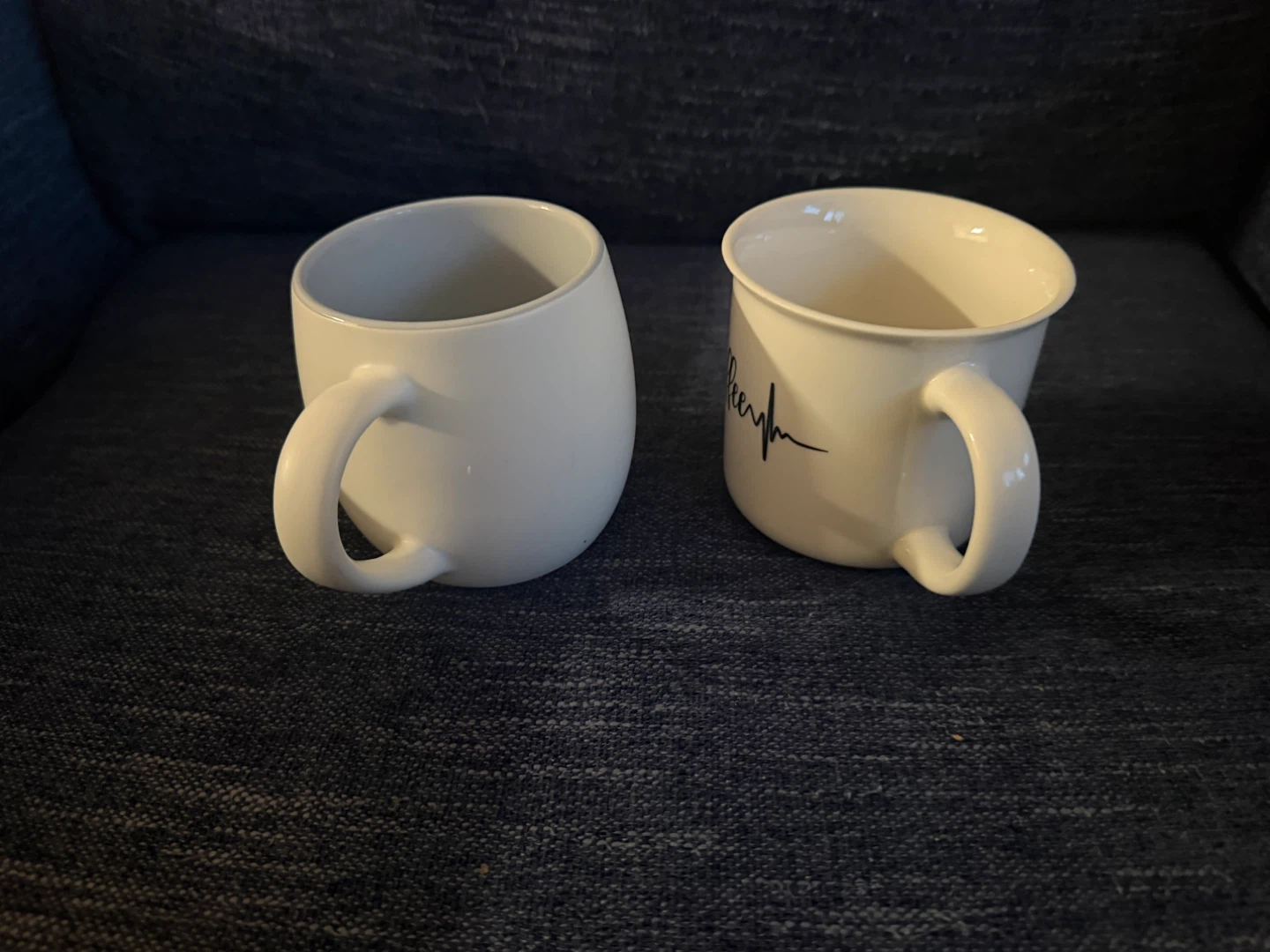 Two white mugs with handle