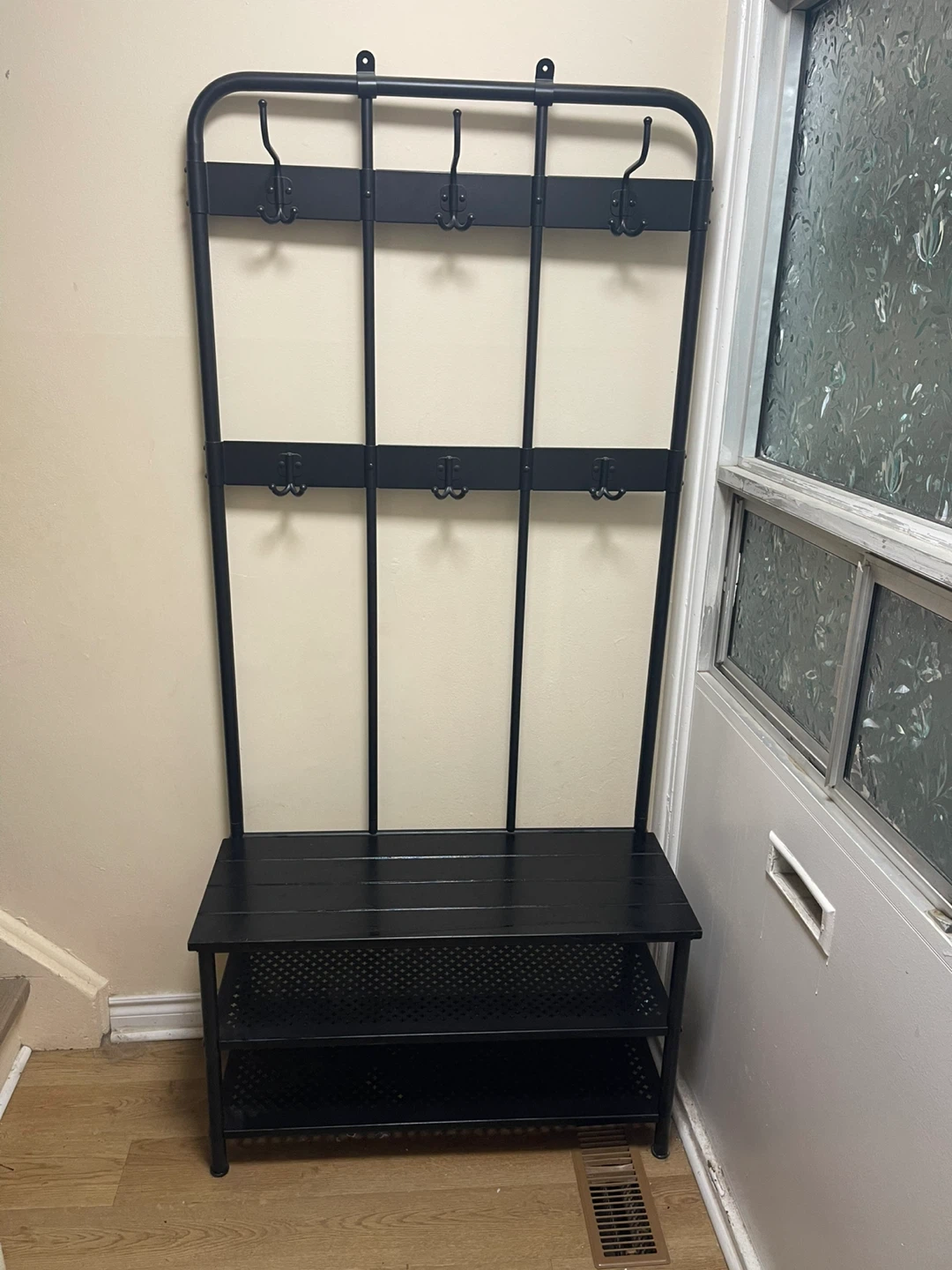 black metal jacket/shoe rack