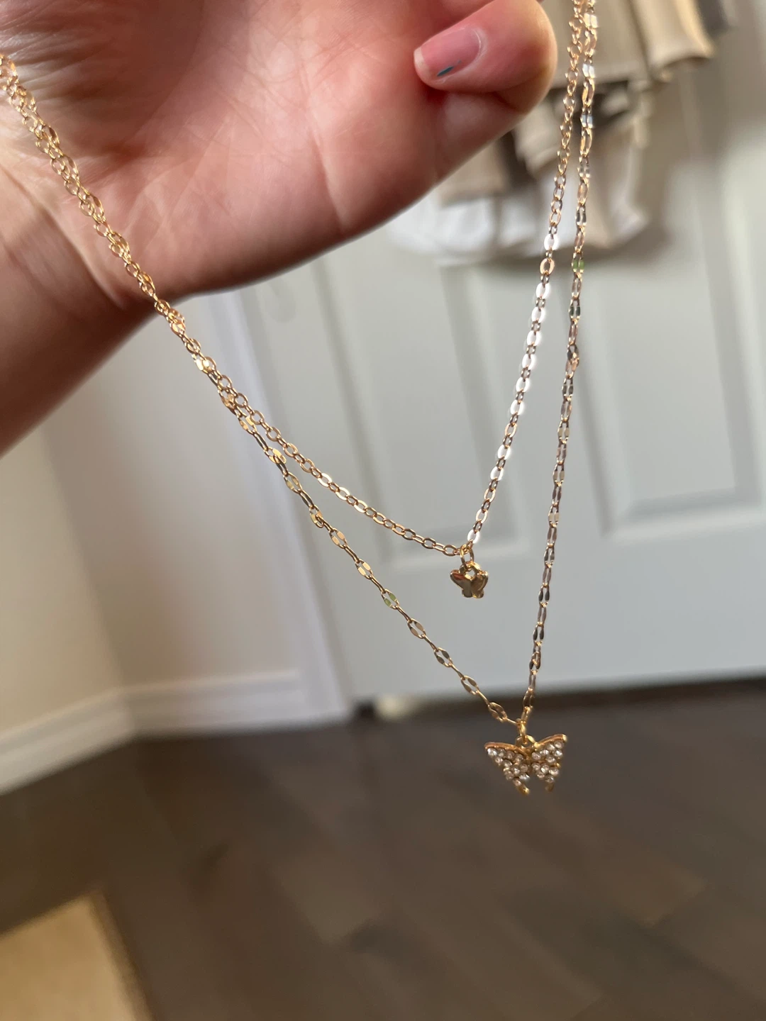Gold-tone layered necklace with butterfly charms