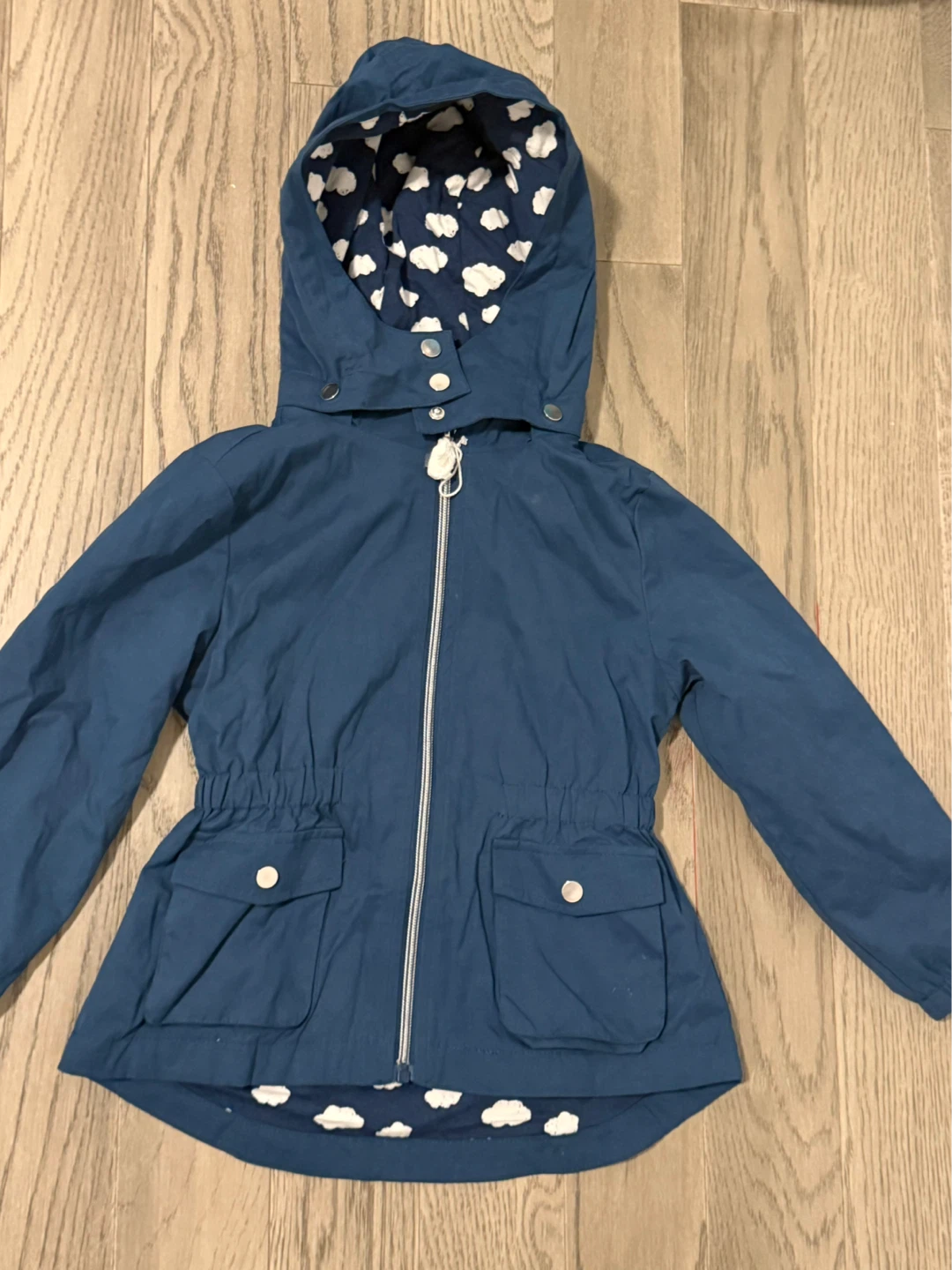 Blue hooded jacket with cloud print lining