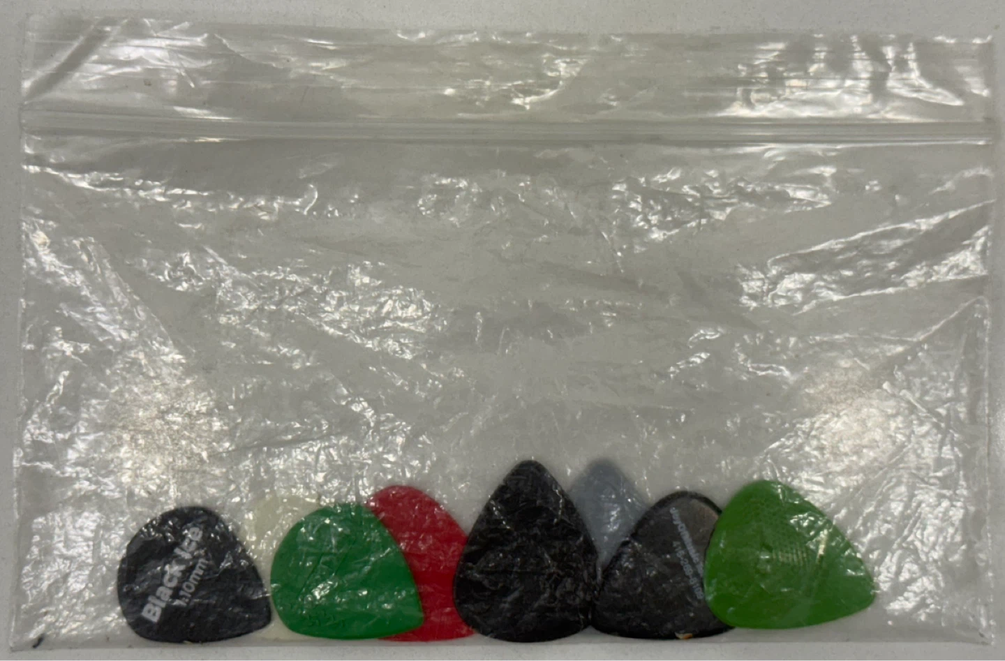 8 Assorted Guitar Picks Different Colours and Sizes