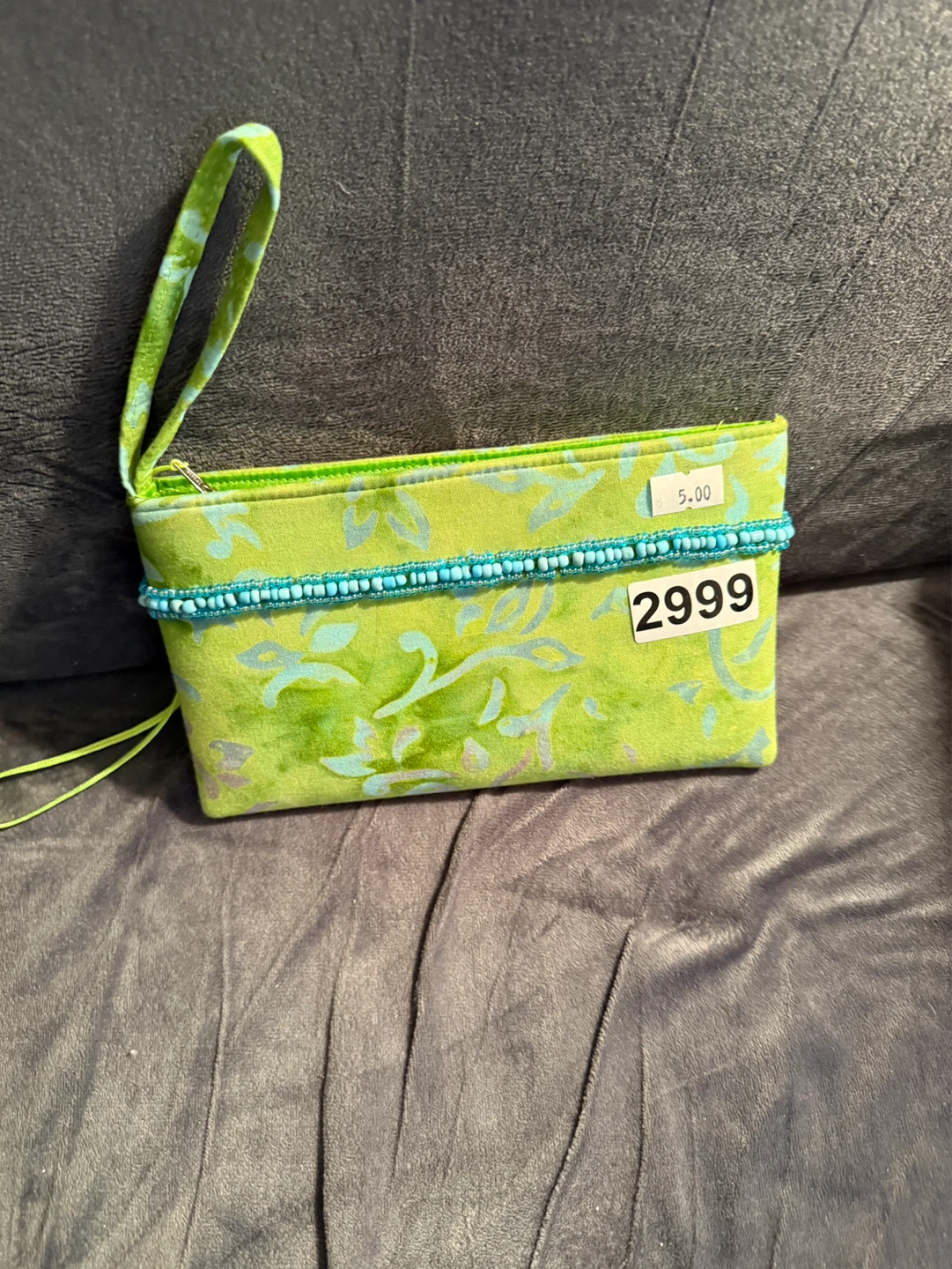 Green floral wristlet with blue beaded trim
