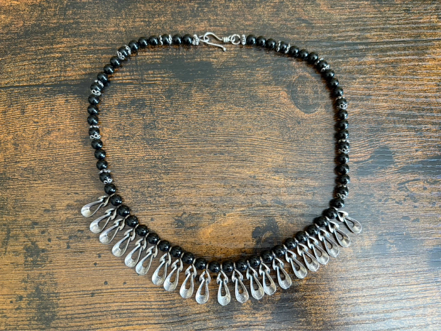 Black Beaded Necklace with Silver Charms