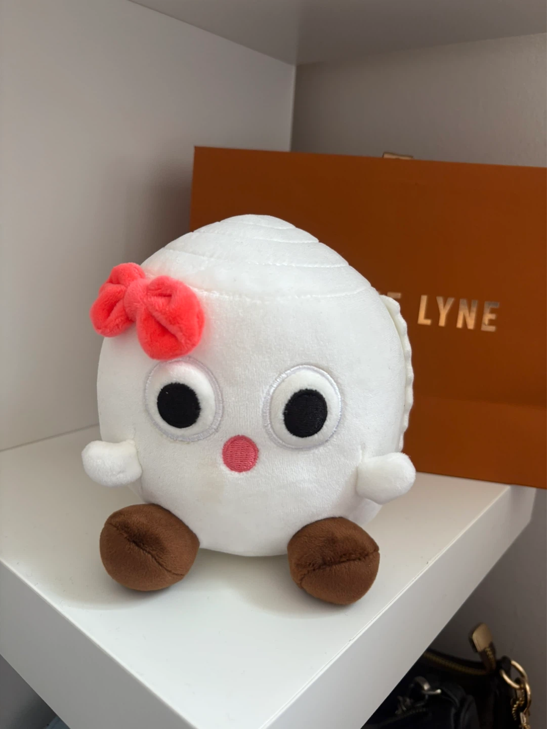 White Plush Ball Toy with Pink Bow