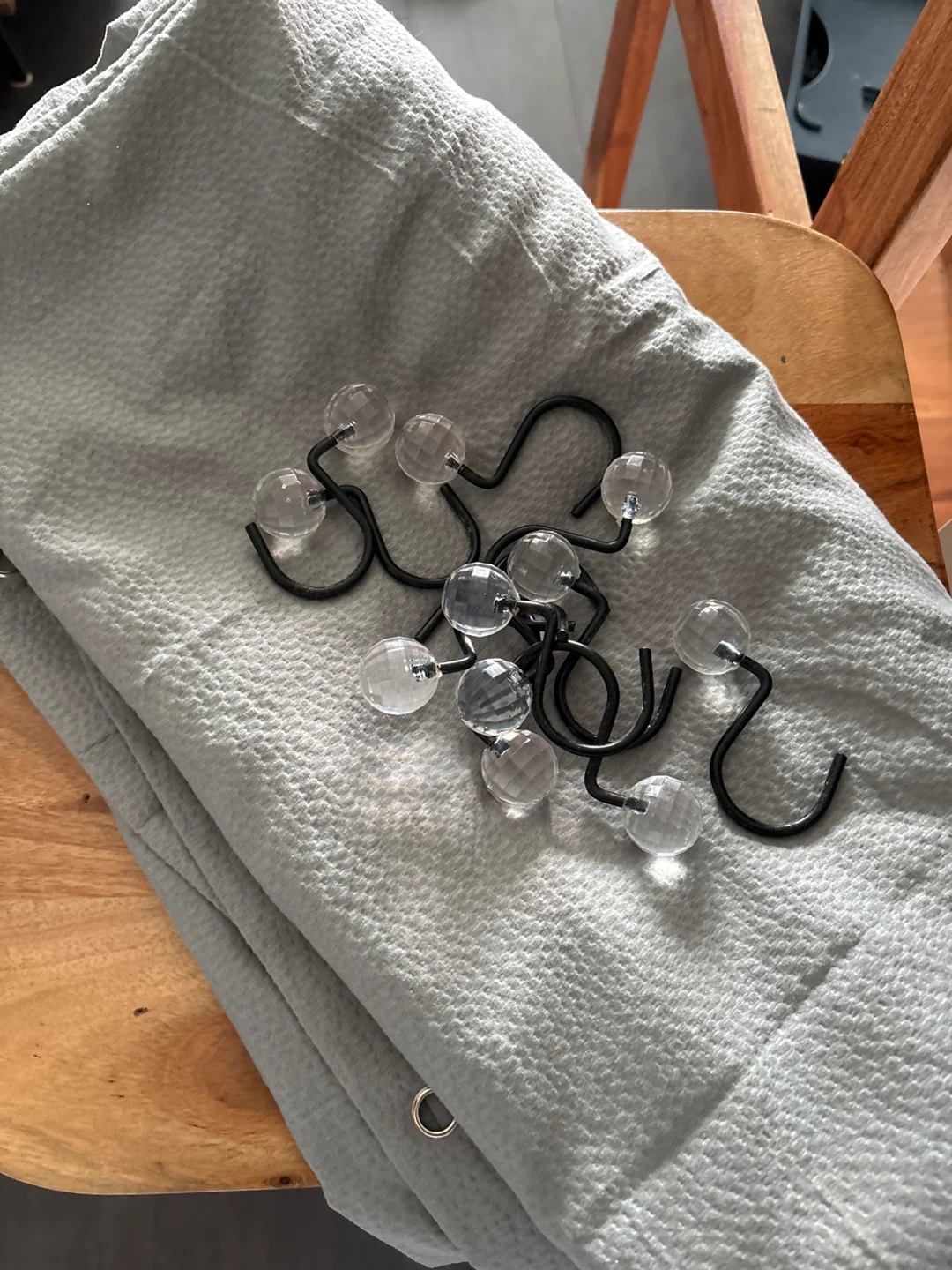 Grey shower curtain and hooks