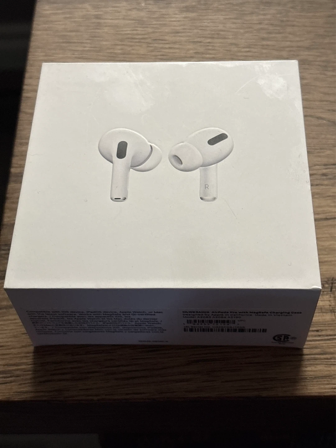AirPod Pro (left) with MagSafe Charging case