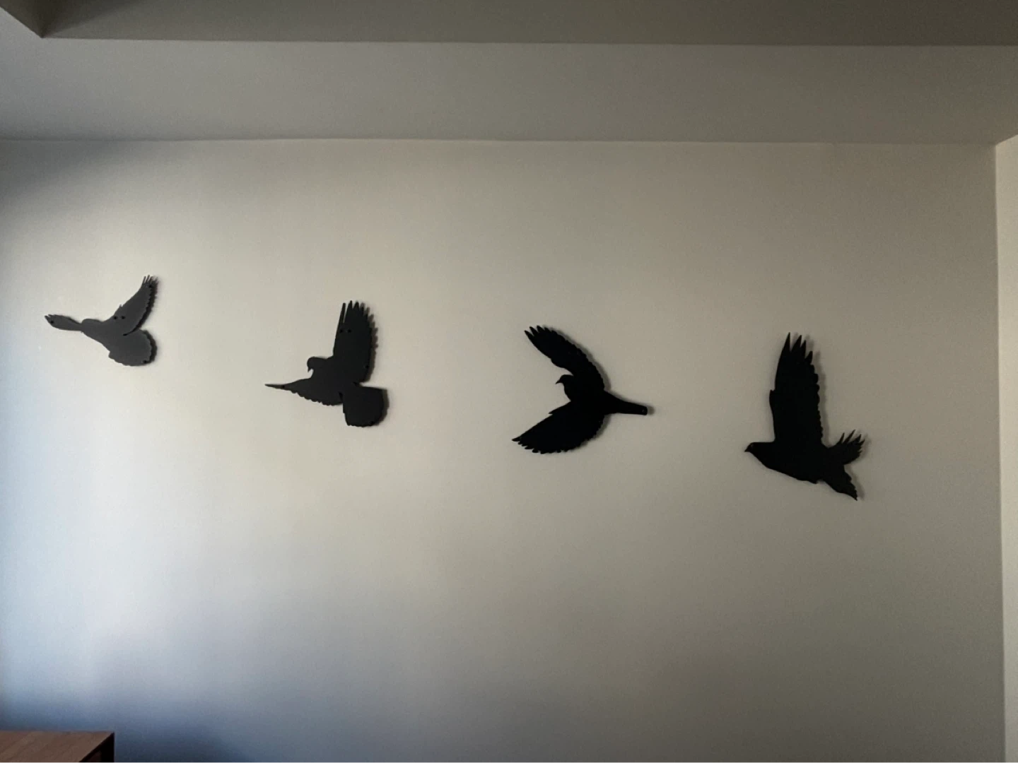 Black metal bird wall art