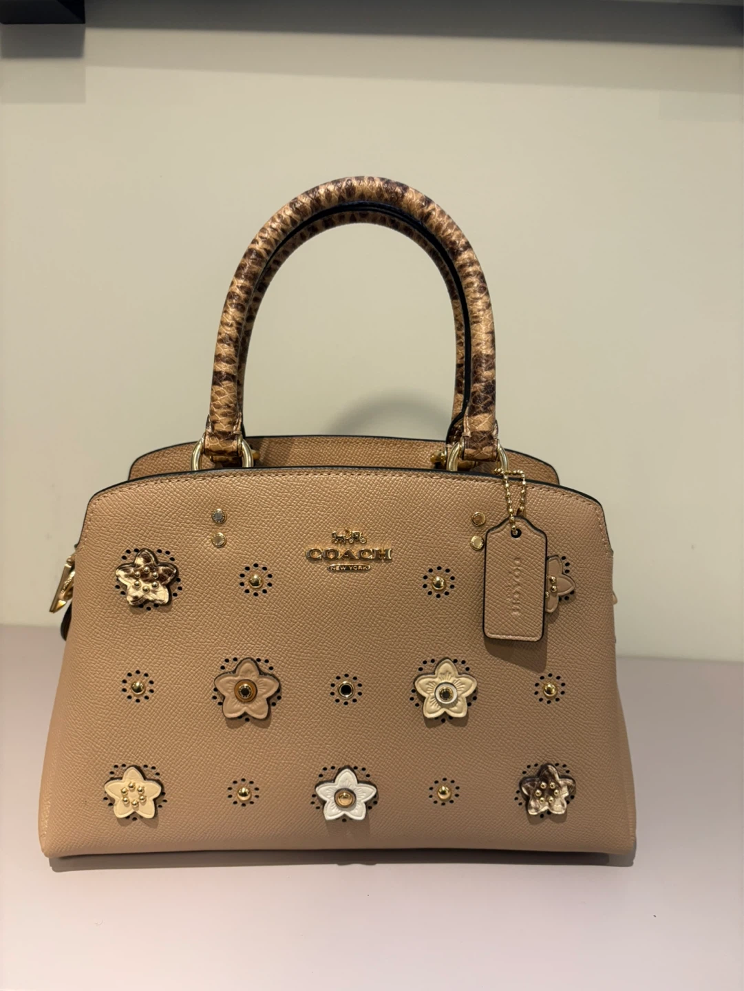 Coach Handbag with Flower Embellishments