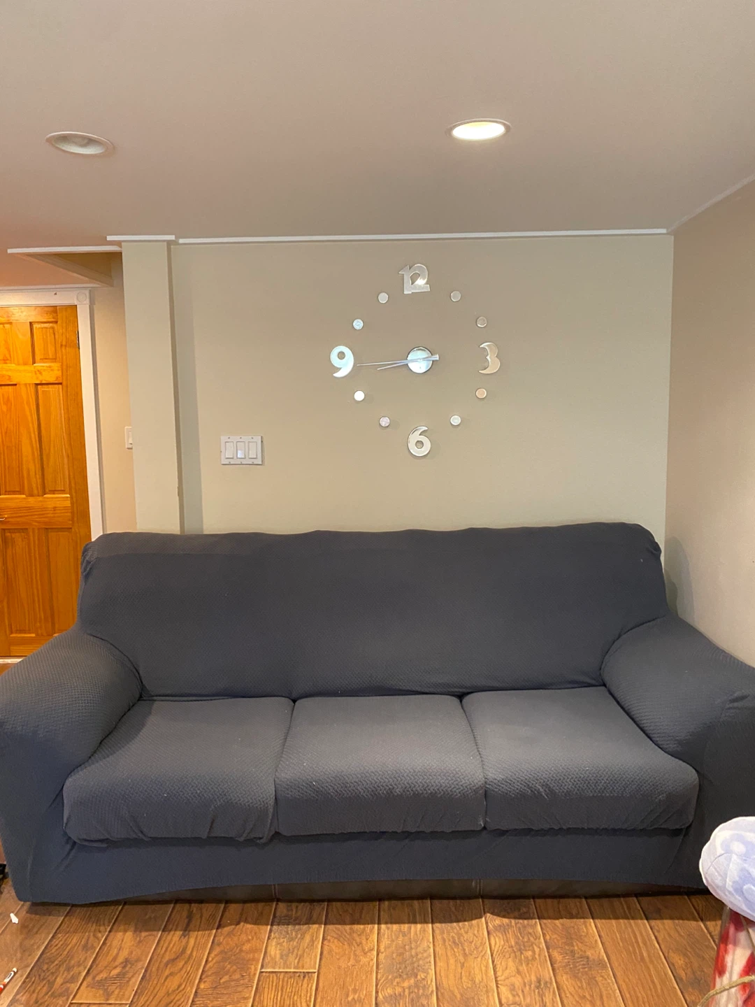 Black Sofa with Protective Cover