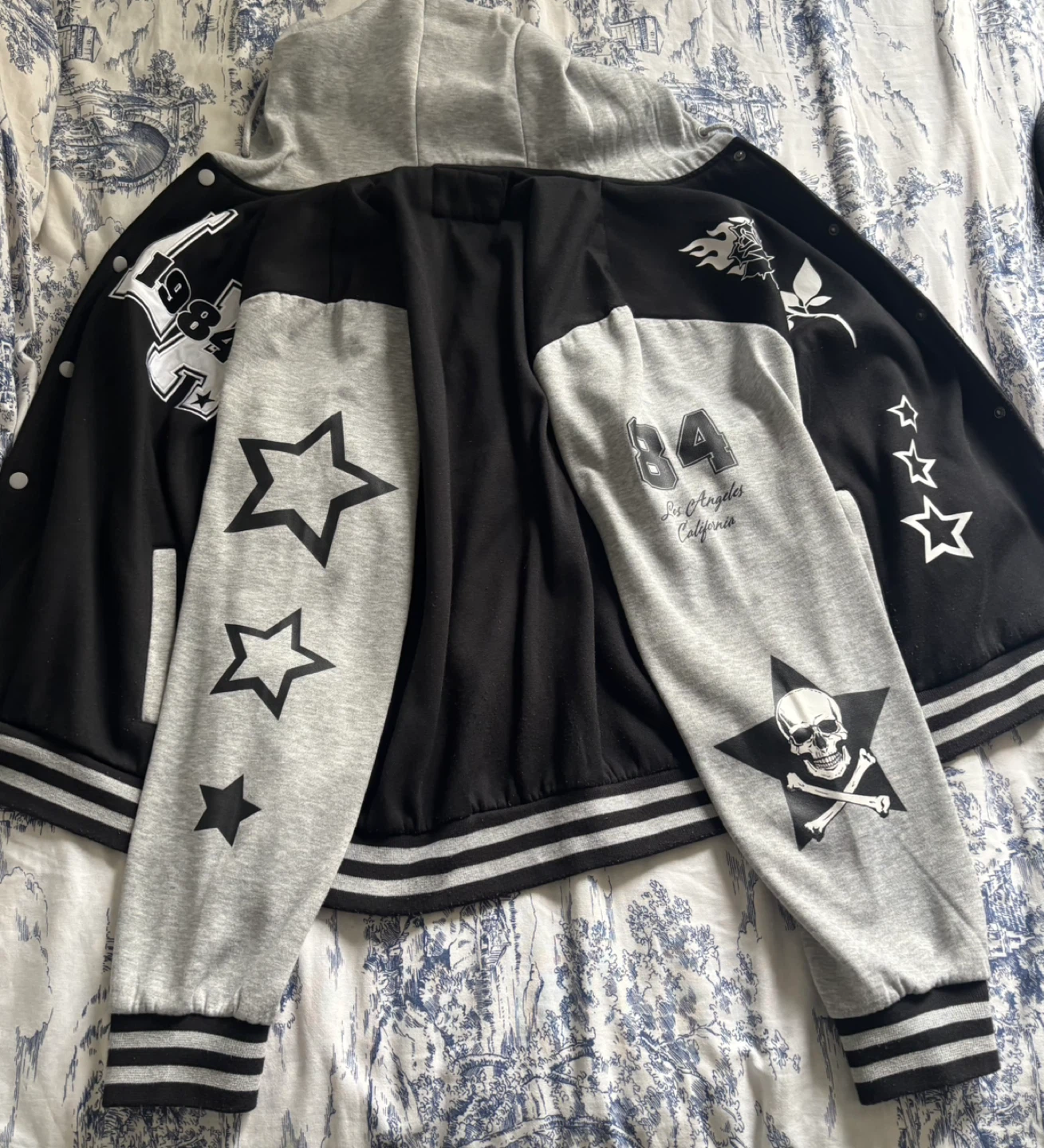 Black and grey varsity-style bomber/letterman jacket