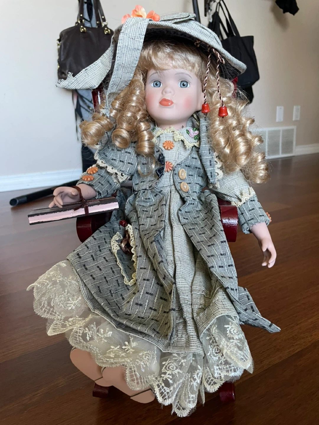 Porcelain Doll with Hat and Book