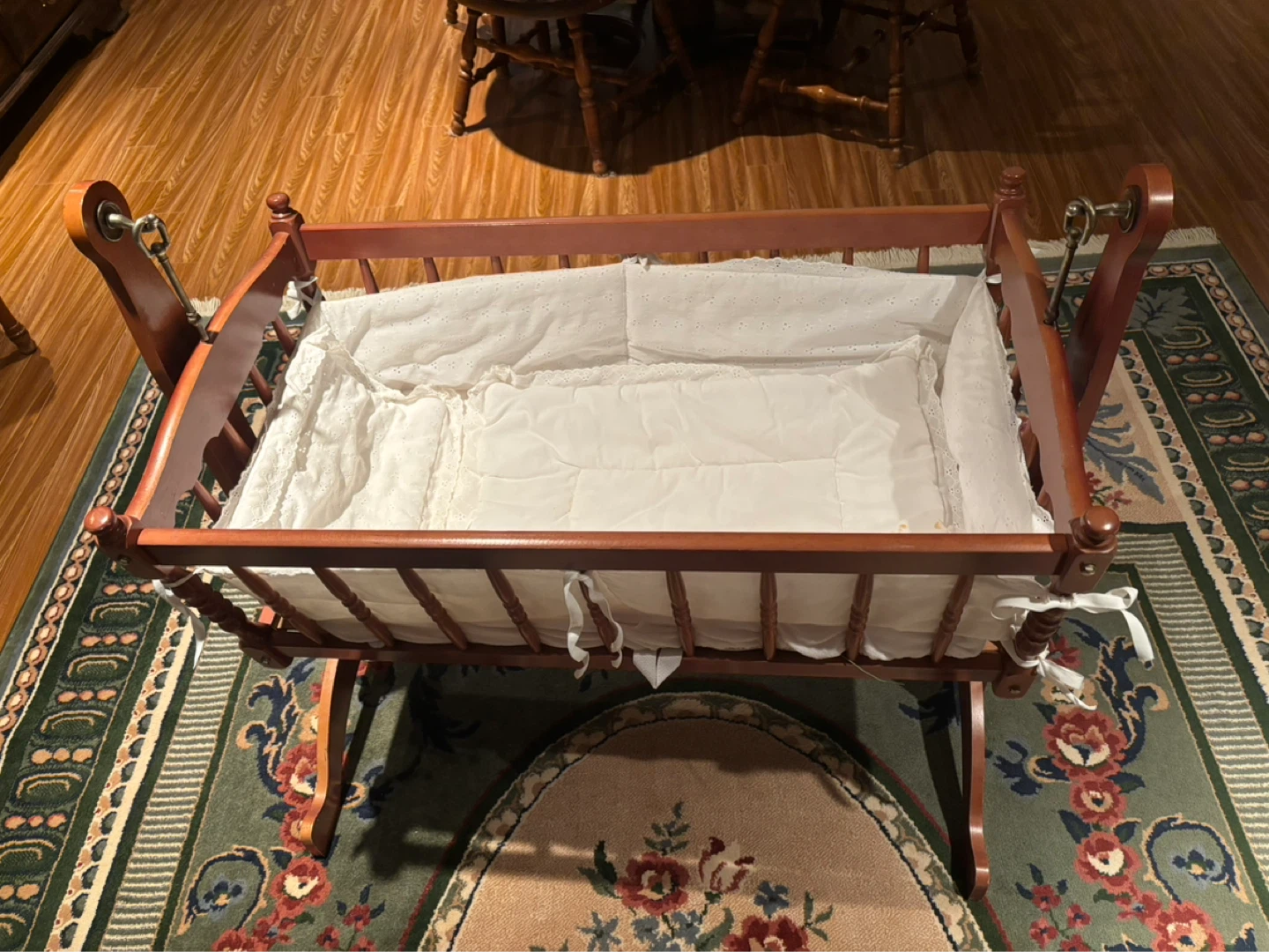Wooden Baby Cradle with White Linens