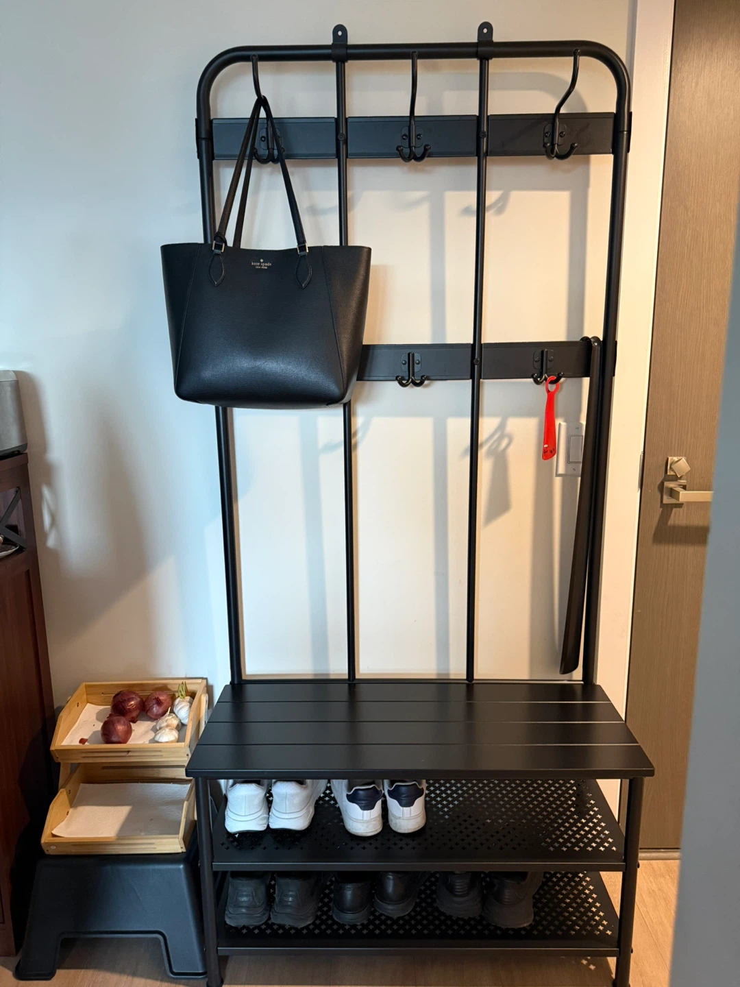 Black metal hall tree with bench and shoe rack