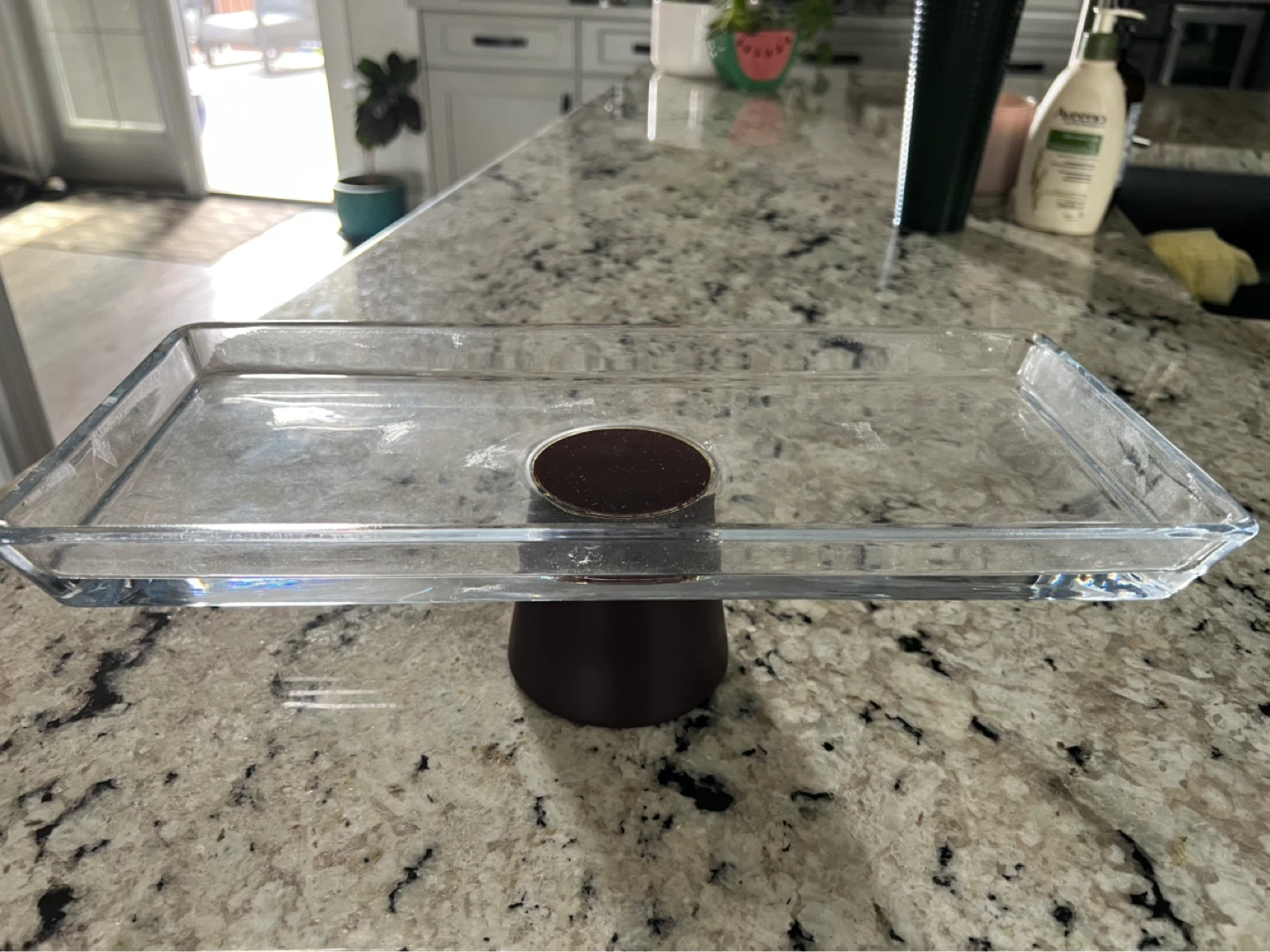 Glass cake stand with dark brown base