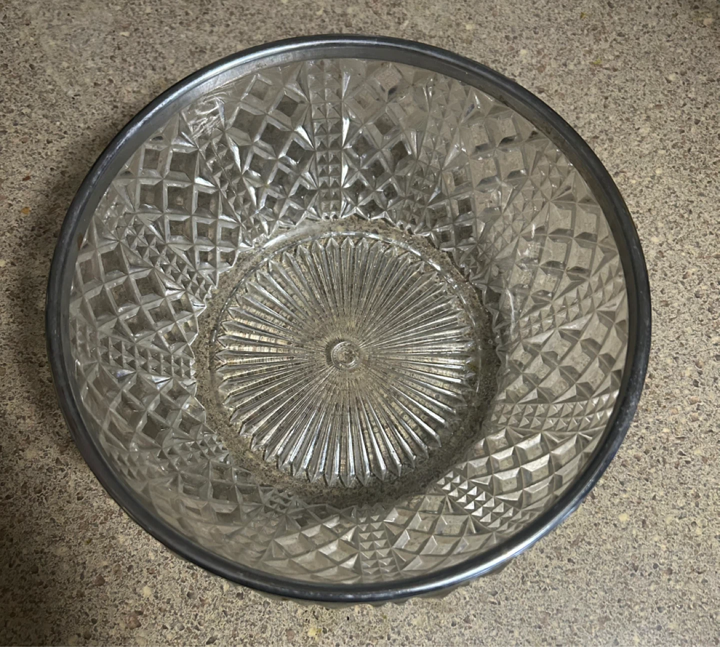 Glass serving bowl with metal rim