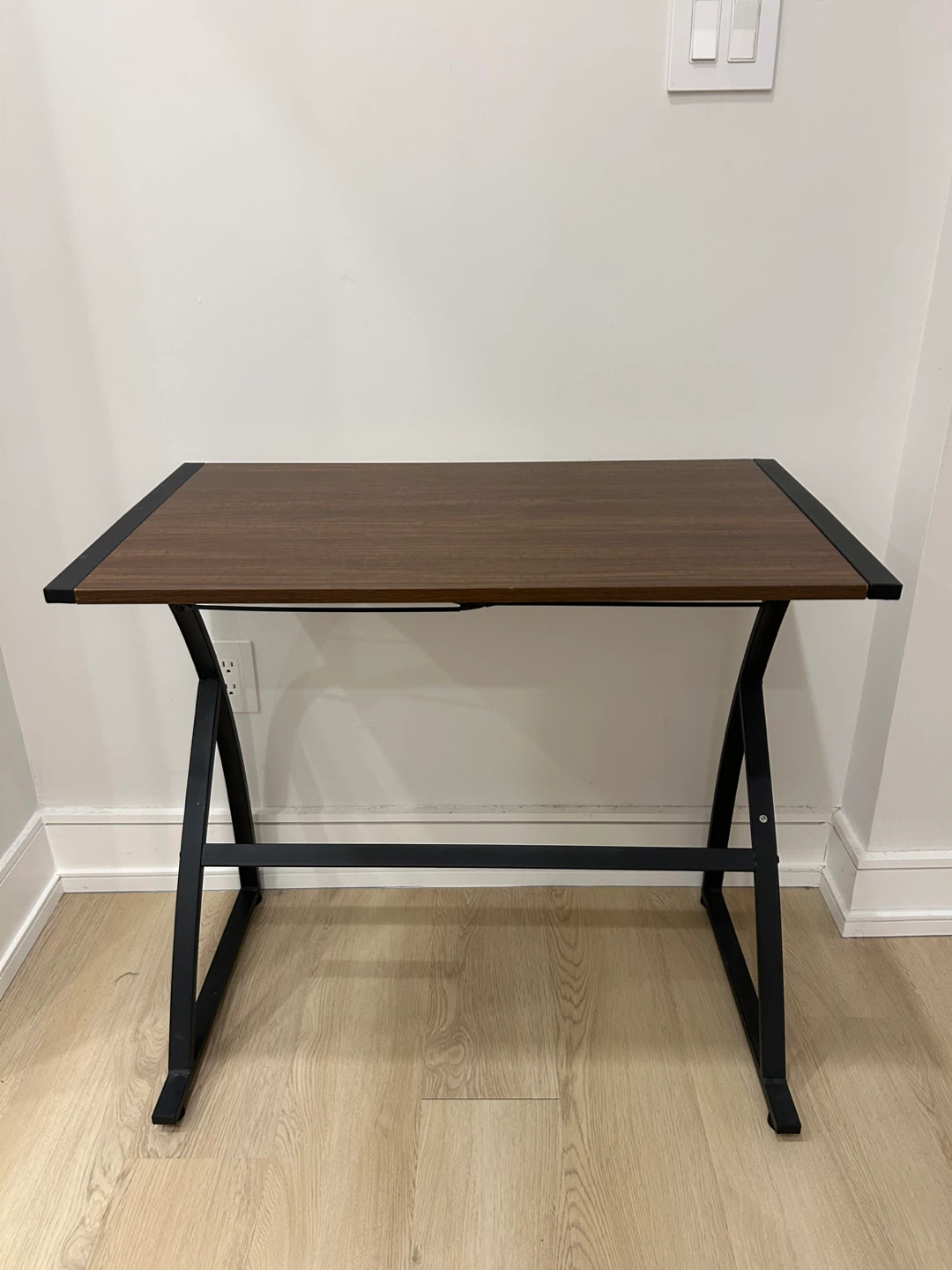 Small computer desk with black leather office chair