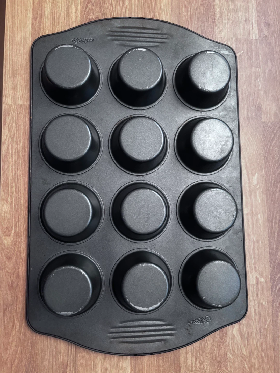 Used Wilton 12-Cup Muffin Tin - photo 2