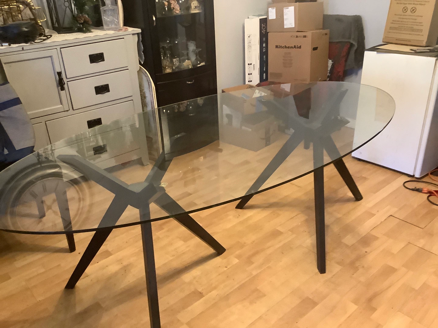 Oval Glass Dining Table with Black Metal Base
