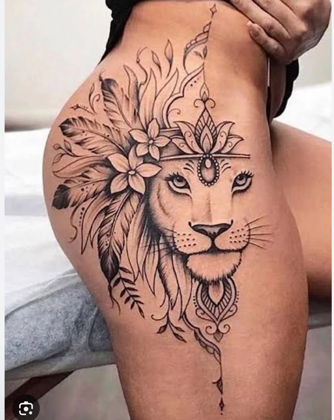 Lioness Head with Floral and Feather Design Tattoo