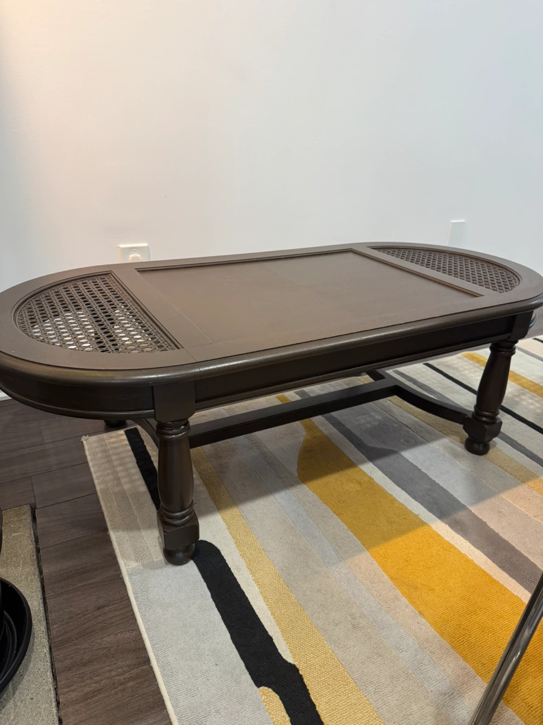 Dark Brown Oval Coffee Table with Cane Accents