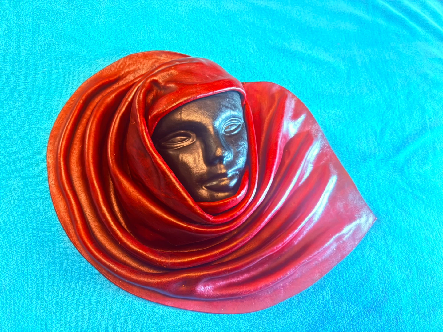 Leather wall mask ornament.