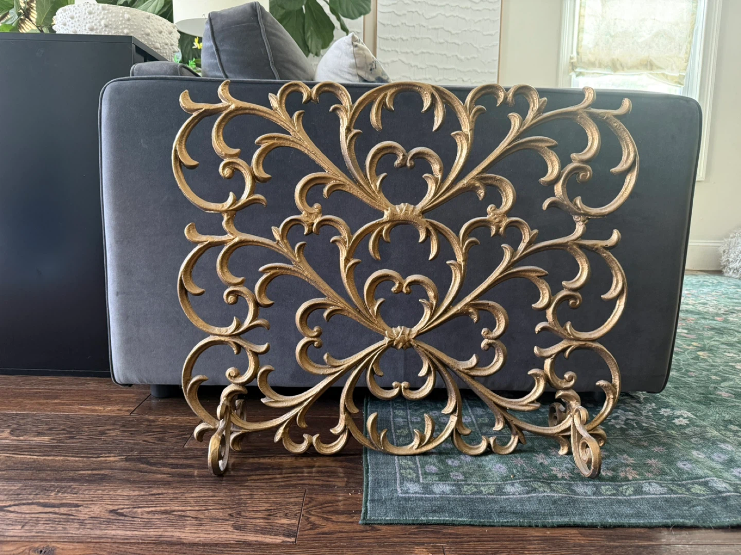 Gilt iron fireplace screen with acanthus leaf  and scroll design