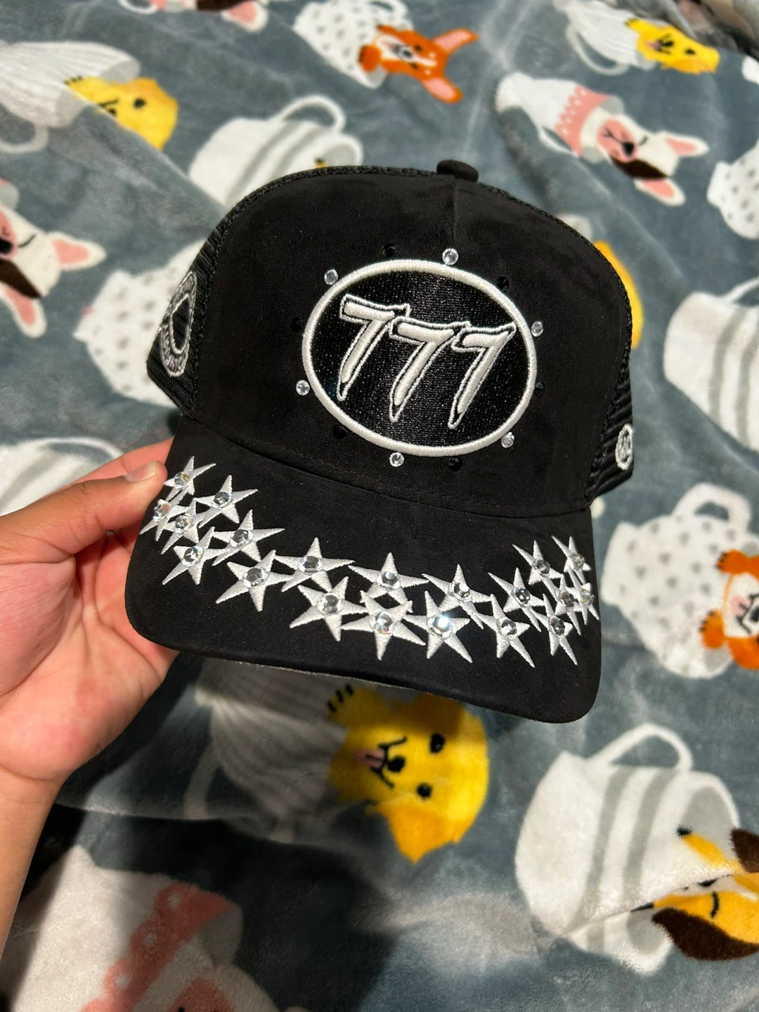 Black Trucker Hat with Stars and 777 Design