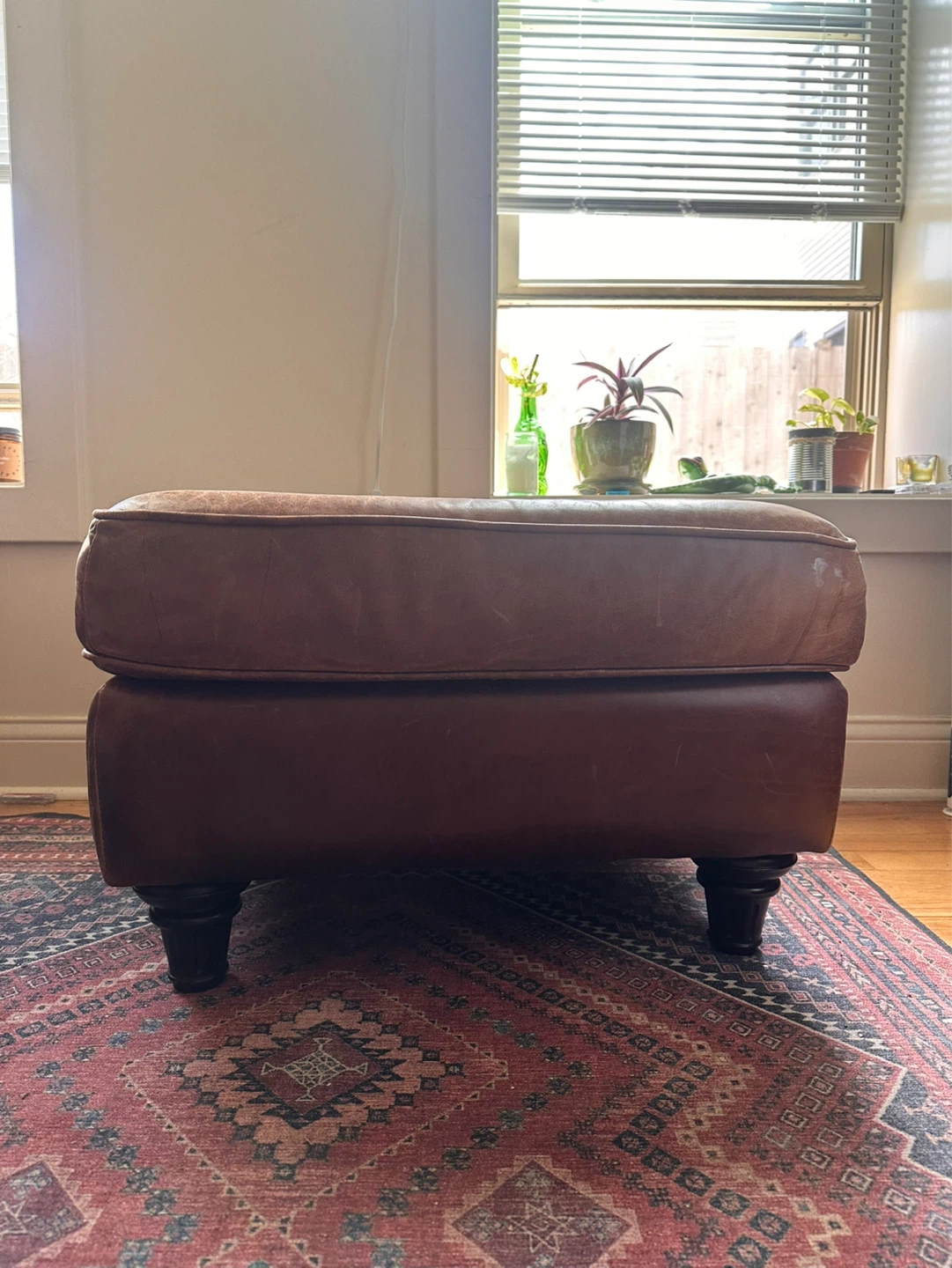 Brown leather ottoman