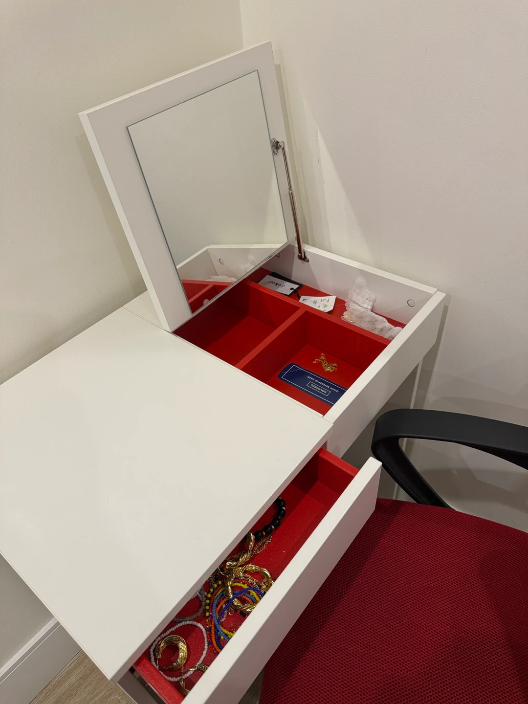Dresser and Red Mesh Office Chair
