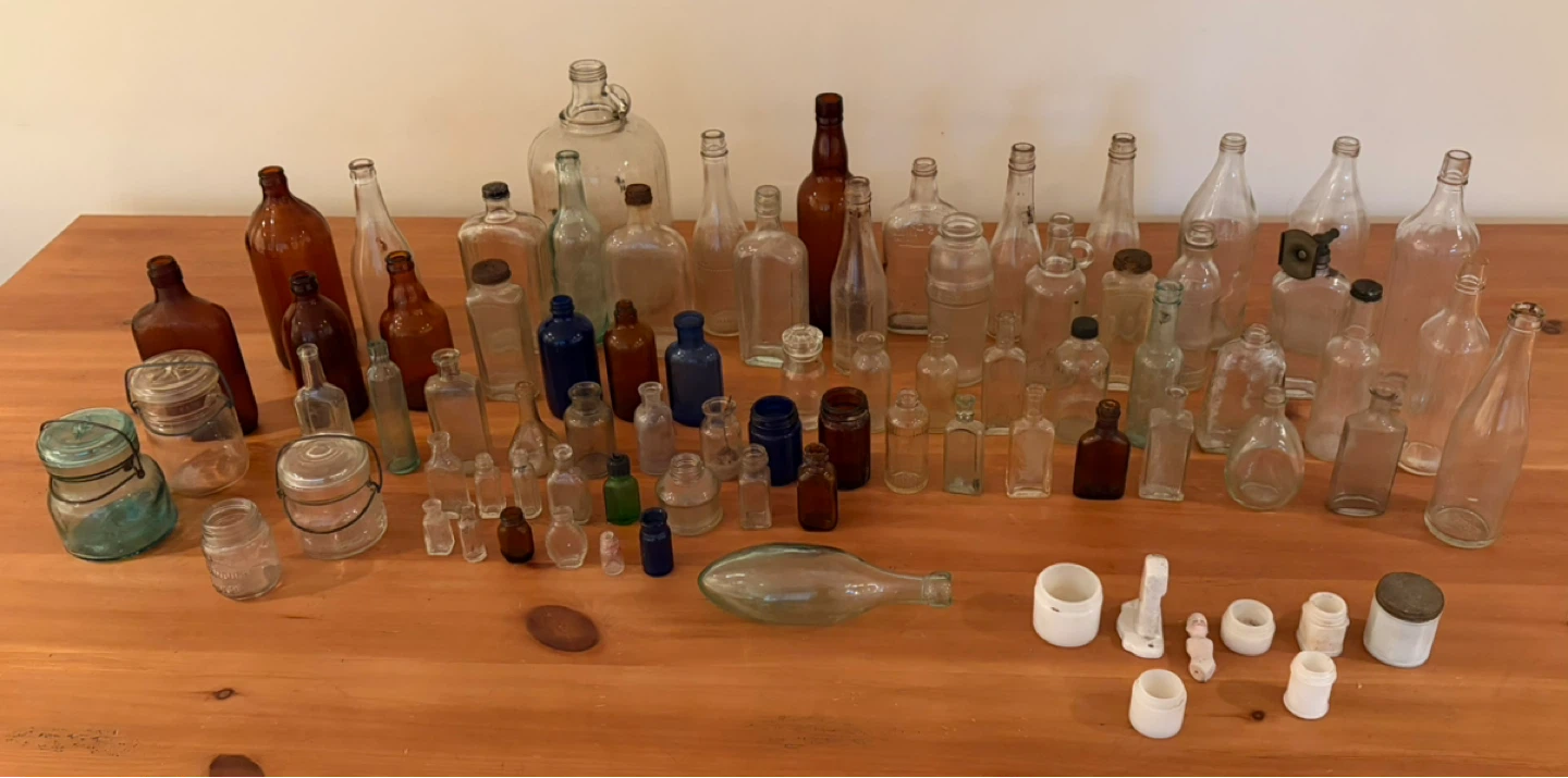 Collection of Vintage Glass Bottles and Jars