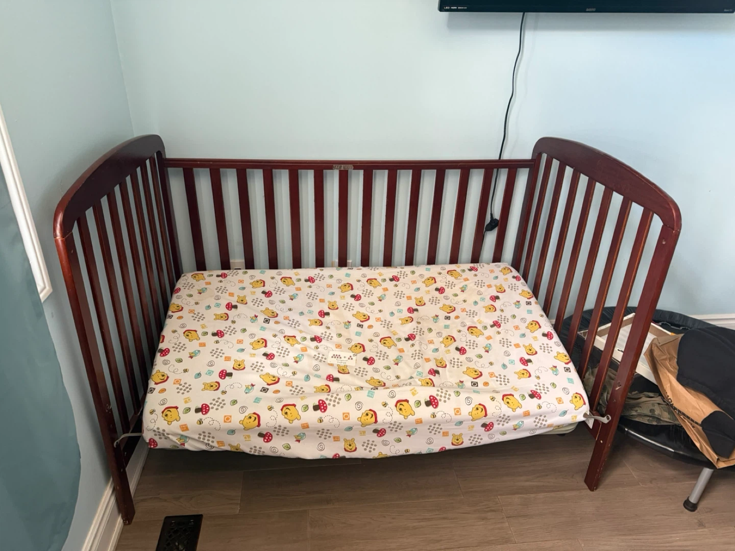 Dark Wood Baby Crib with Winnie the Pooh Mattress